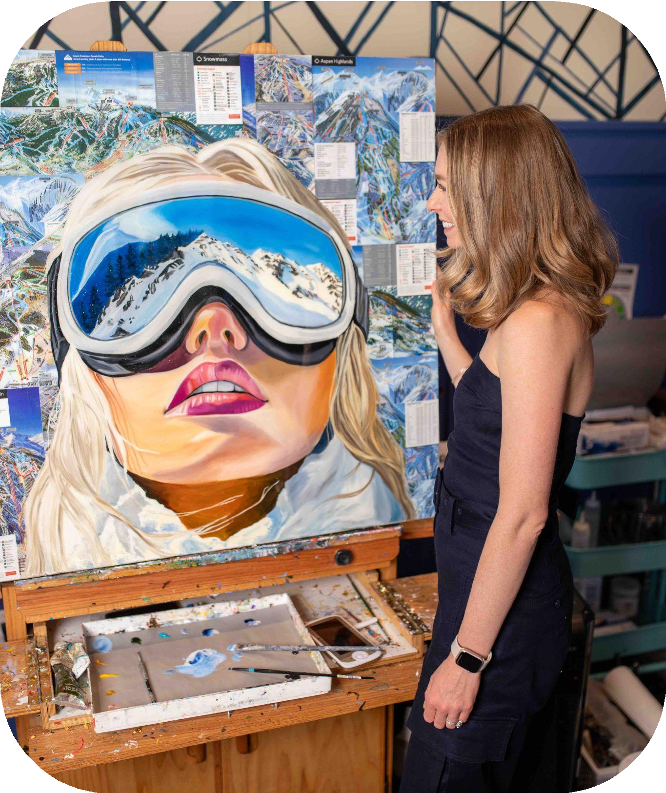 Artist painting snowy mountain reflection goggles
